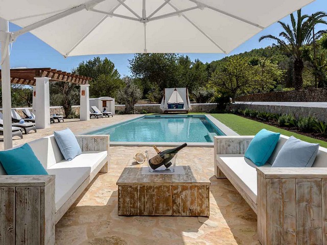 seating area by villa pool